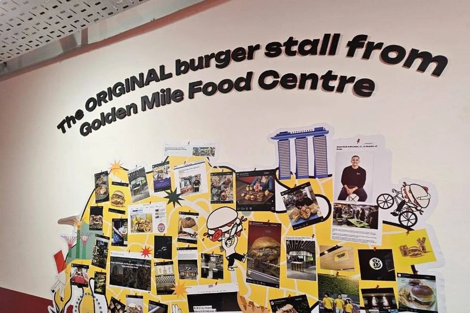 Burgs history wall recalling its original Golden Mile Food Centre stall